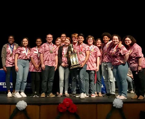 The decathlon team that is comprised of juniors and seniors are presented with the district first place trophy and medals. The team competed in ten categories against all GISD high schools.